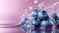 Fresh ripe blueberries with water splash and droplets on pink background, macro shot with reflection showing juicy berries in dynamic composition.