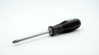 Black handled Phillips head screwdriver with metal shaft isolated on white background for tool and hardware design projects.