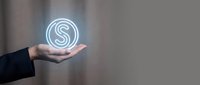 Business professional holding glowing dollar sign hologram symbol representing financial success, investment opportunities, and digital economy concepts.