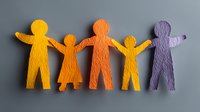 Colorful paper cutout figures holding hands on gray background, representing family unity, diversity, and community support.
