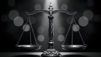 Ornate justice scales with decorative metalwork on dark background with bokeh lights for legal and law firm branding materials.