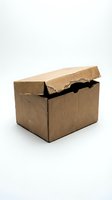 Damaged brown cardboard shipping box with torn lid on white background isolated for packaging and delivery concepts.