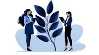 Two professional businesswomen collaborate around large plant branch symbolizing growth, teamwork and environmental sustainability in corporate setting.