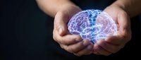 Hands holding glowing digital brain with neural networks representing artificial intelligence, mental health, neuroscience and cognitive technology concepts.