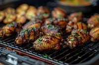 Juicy grilled chicken thighs with caramelized glaze and fresh herbs cooking on barbecue grill grates, close-up view showing char marks and glistening marinade.