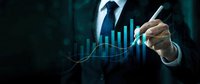 Businessman drawing upward trending financial graph with pen showing growth analytics and market success on dark background for business presentations.