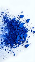 Blue powder and shattered fragments explode across white background, creating dynamic dispersion effect. Suitable for design, creativity, transformation, and abstract concepts.