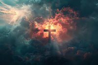 Christian cross silhouette against dramatic sunset sky with glowing red clouds and divine light rays breaking through stormy atmosphere. Spiritual concept.