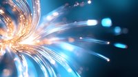 Glowing optical fibers emit bright blue and orange light streams against dark background, creating dynamic motion effect for technology and communication designs.