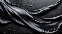 Glossy black liquid waves with water droplets on dark surface creating elegant flowing motion for luxury cosmetics and skincare product backgrounds.