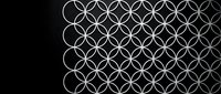 Elegant white geometric circles pattern on black background creating sophisticated interlocking design for modern decor and branding applications.