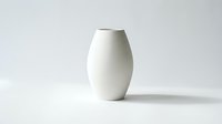 White ceramic vase with smooth, rounded form on neutral background, isolated for home decor, interior design, and product display applications.