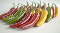 Fresh colorful chili peppers arranged in row on light background, red, green and yellow hot peppers with glossy surface and curved shapes creating pattern.