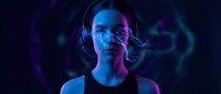 Young Caucasian man with futuristic digital interface overlay and neon lighting effects for technology and innovation concepts.
