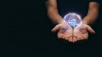 Male hands holding glowing crystal ball with electric energy effects on dark background for fortune telling and mystical concepts.