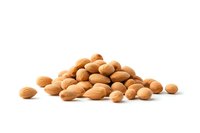 Fresh whole almonds scattered in pile on white background, raw natural nuts isolated for healthy eating and snack food packaging design purposes.