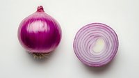 Fresh red onion whole and sliced ring on white background, showing vibrant purple layers and natural texture. Food ingredient for cooking and garnish.