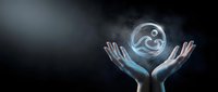 Hands holding glowing digital yin yang symbol against dark background, representing balance, harmony, wellness, and spiritual energy for meditation and mindfulness concepts.