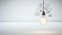 Glowing light bulb with creative business doodles floating above on clean white background representing innovation and entrepreneurship concepts.