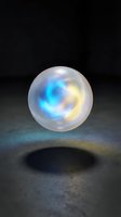 Luminescent sphere with swirling blue and yellow energy patterns floating above textured ground, casting shadow. Glowing orb for fantasy, sci-fi, magic, and digital art projects.