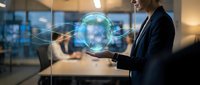 Businesswoman in dark suit holding glowing digital globe with network connections in modern office environment, representing global communication and international business technology.