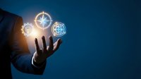 Businessman hand holding glowing digital globe and compass icons against blue background, representing global navigation, international business, and technology connectivity.