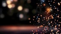 Magical glowing particles and bokeh lights creating ethereal atmosphere against dark background, orange and blue sparkles floating in space.