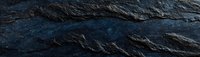 Dark blue stone texture with rough surface and natural mineral patterns creates dramatic backdrop for luxury product photography and website headers.