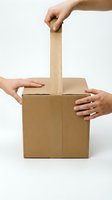 Hands opening cardboard box with handle against white background, representing delivery, unboxing, shipping and logistics for e-commerce.