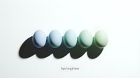 Five pastel Easter eggs arranged in a gradient row from blue to green on white background with dramatic shadows and springtime text.