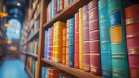 Colorful vintage hardcover books arranged on wooden library shelf with soft focus background creating cozy atmosphere for reading and education concept.