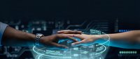 Diverse hands joining together over glowing digital interface with circuit board background, representing teamwork, collaboration, and technology partnership for business solutions.