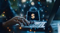 Glowing digital padlock with dollar symbol over hands typing on laptop keyboard, representing online banking security and financial technology protection.