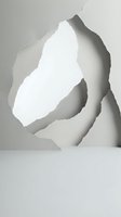 Torn paper hole revealing white background with jagged edges and shadow effects for creative design projects and artistic compositions.
