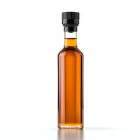 Glass bottle with amber liquid and black cap on white background with reflection, isolated product photography for beverage and spirits marketing.