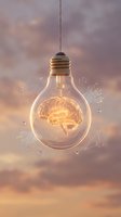 Glowing light bulb with illuminated brain inside suspended against cloudy sky backdrop, surrounded by floating geometric shapes, symbolizing creativity, innovation, and intellectual ideas for business concepts.