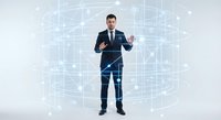 Professional businessman in dark suit presenting digital network interface with glowing connections and data visualization elements on white background.