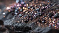 Colorful glitter particles scattered on dark stone surface creating magical contrast between rough texture and sparkling light reflections.