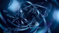 Shattered glass fragments swirling in a dark blue vortex, creating a dramatic abstract explosion effect with glowing light reflections.