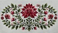 Elegant floral embroidery design featuring red poinsettia with green leaves and decorative flourishes on cream fabric background for holiday crafts.