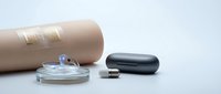 Modern wearable health technology devices including smart contact lens, electronic skin patches and fitness tracker on clean white background for medical innovation.