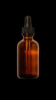 Amber glass dropper bottle with black pipette cap isolated on transparent background, ready for cosmetics, essential oils, serums, and wellness product packaging designs.