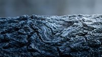 Weathered tree bark texture with deep grooves and natural patterns, suitable for backgrounds, design elements, and nature-themed projects.