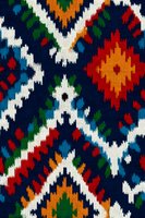 Colorful ethnic knitted textile with traditional geometric patterns in red, orange, blue and white. Folk art fabric design for cultural projects and decorations.
