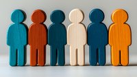 Colorful wooden figures standing in row representing diversity, teamwork and social community. Minimal composition on light background for business concepts.