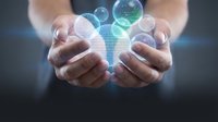 Caucasian male hands holding glowing digital spheres with network data visualization, representing technology, connectivity, and business innovation for corporate communications.