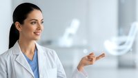 Female healthcare professional in white coat presenting medical innovation with holographic DNA strand in modern clinical setting.