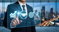 Professional businessman touching digital interface with business icons including growth chart, handshake, target and email in modern office.