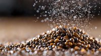 Black peppercorns falling and creating dynamic spice composition with scattered grains on dark background, macro food photography for culinary design.