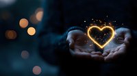 Glowing heart shape made of golden light particles floating between cupped hands against dark background with bokeh lights, magical romantic atmosphere.